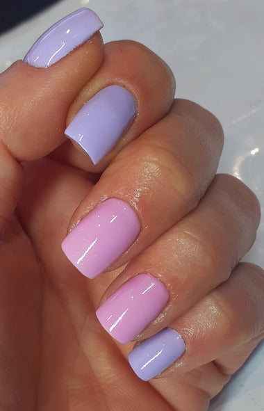 Short square nails with pastel pink and purple nail polish