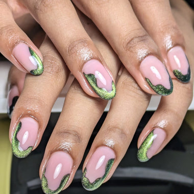 Close-up of hands with pink and green nail polish