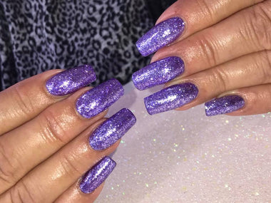 Square shaped gel nails with purple glitter nail polish