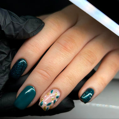 Hand with teal nail polish on a black background - halo gel polish harmony