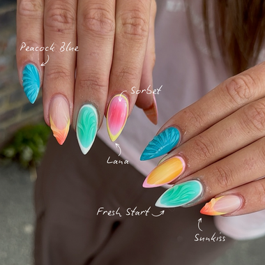 Close-up of hands with colorful nail art labeled 'Peacock Blue', 'Sorbet', 'Lana', 'Fresh Start', and 'Sun Kiss'.