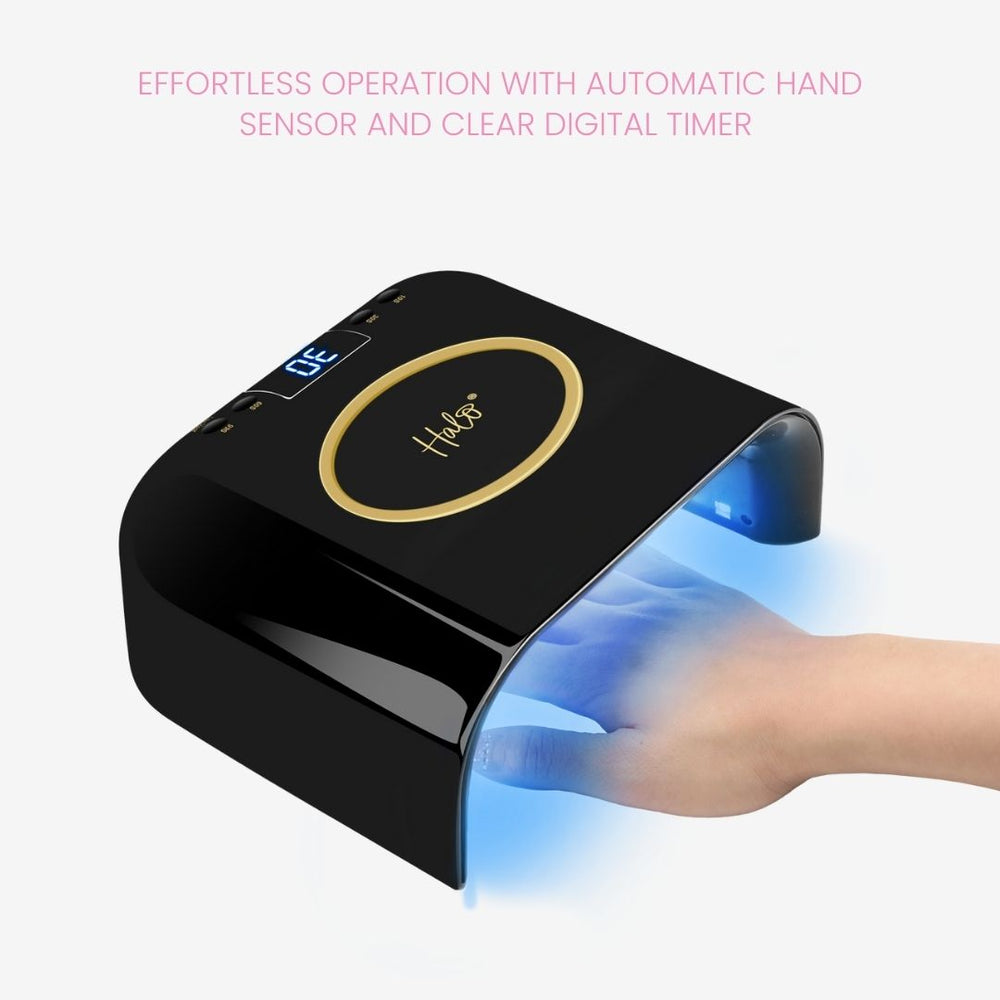 Black nail dryer with digital display and hand sensor on a white background