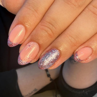 Close-up of a hand with pink and glittery nails   - halo gel nail polish shade pink diamond