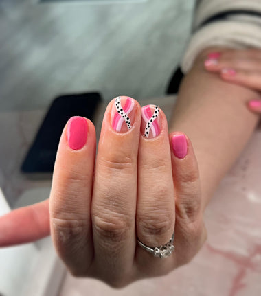 Pink and white swirl nail art using the Halo gel polish in the shade 'Rose'