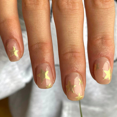 Gold stars nail design using Pure Nails' Halo HEMA-Free glitter gel polish in shade 'gold'