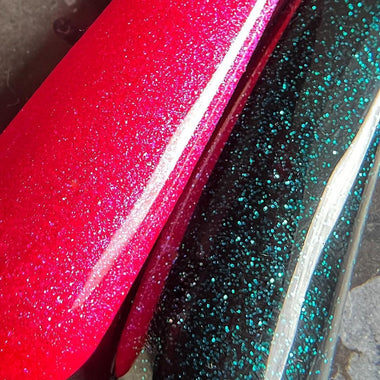 Close-up of red and black glittery vinyl sheets