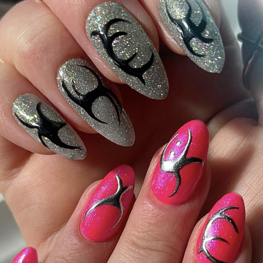 Nails with pink and silver designs on a neutral background