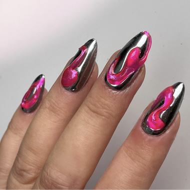 Nails with pink and silver flame design on a neutral background