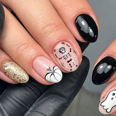 Nails with Halloween-themed designs including ghosts, pumpkins, and spiders.