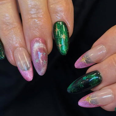 Nails with green and pink glittery design on a dark background