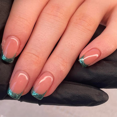 User submitted image of person displaying the shade 'Emerald' painted as french tips on their nails