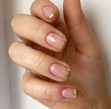 French tips with gold features using the Halo glitter gel polish shade 'gold'