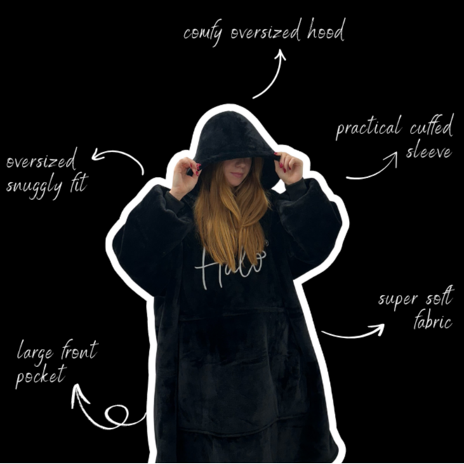 Person wearing a black hoodie with text highlighting features on a black background