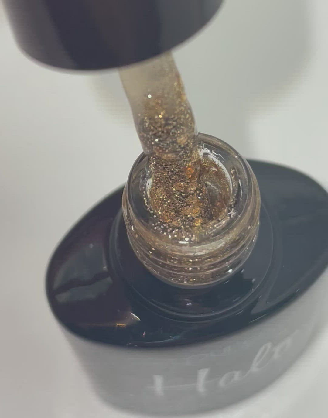 Product video showcasing Pure Nails' Halo Glitter Gel Polish in the shade 'Prosecco'